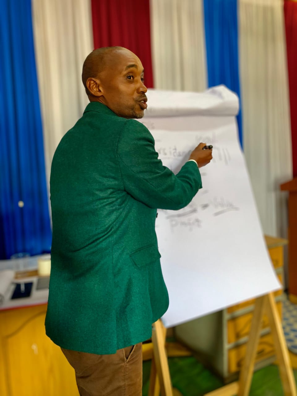 Festus Muasya facilitating a youth entrepreneurship training session